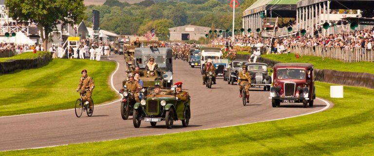 Historic vehicles during the opening parade at the Goodwood Revival.