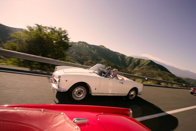 Peugeot 404 Cabriolet by Pininfarina driving on Sicily's legendary Targa Florio route through the Madonie Mountains.