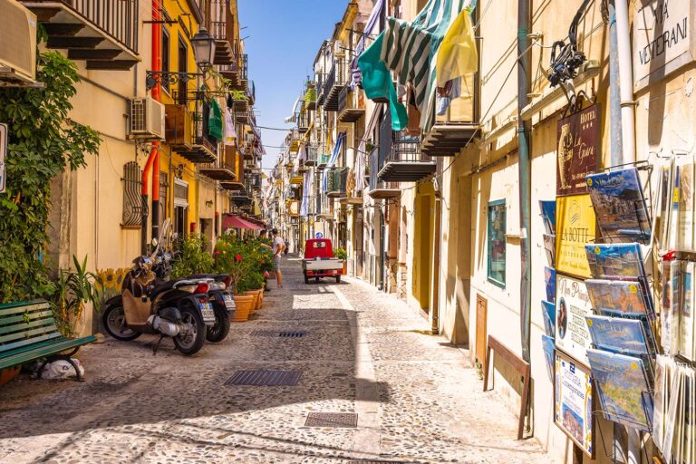 Historic cobbled street in a traditional Sicilian town along the legendary Targa Florio route.