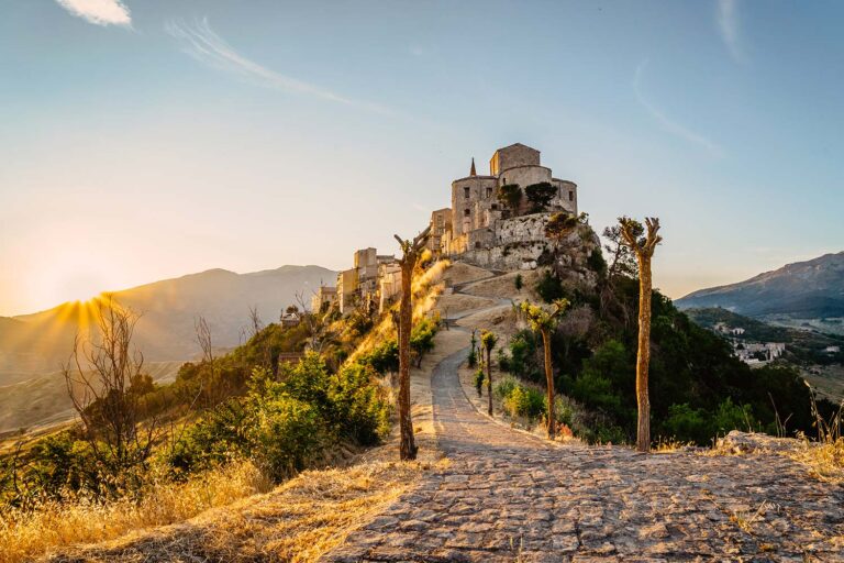 Castelbuono Castle at sunset in Sicily's Madonie Mountains along the legendary Targa Florio route.