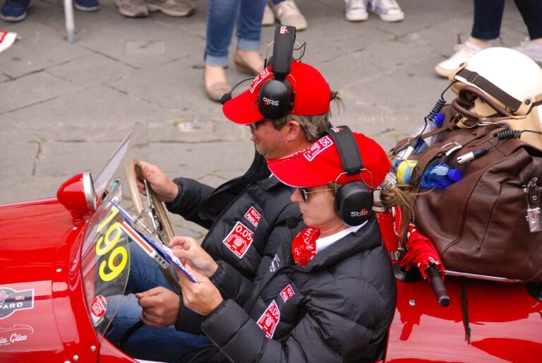 Driver and navigator studying the roadbook during the Mille Miglia.