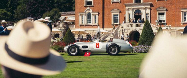Mercedes-Benz Silver Arrow displayed on the lawn in front of Goodwood House.