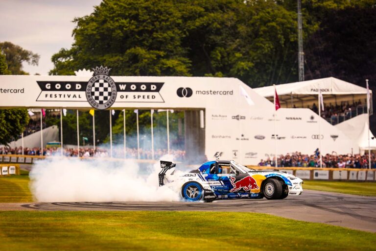 Drift car performing beneath the Festival of Speed bridge at Goodwood.