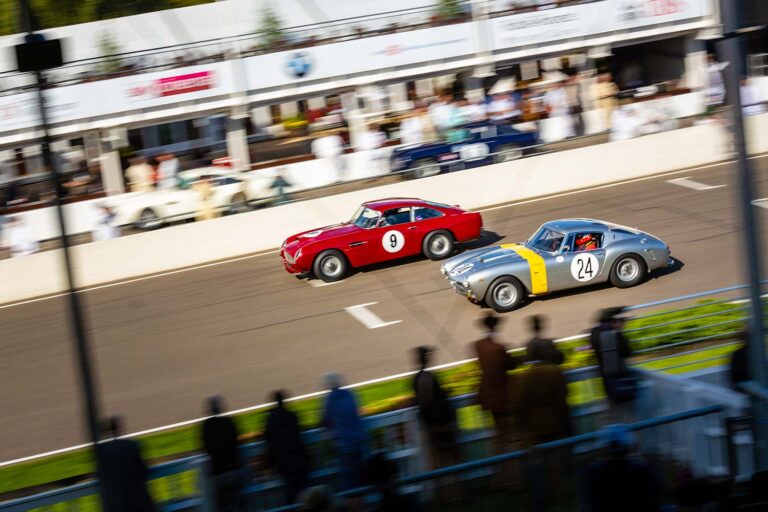 Historic racing cars battling wheel-to-wheel at the Goodwood Revival.