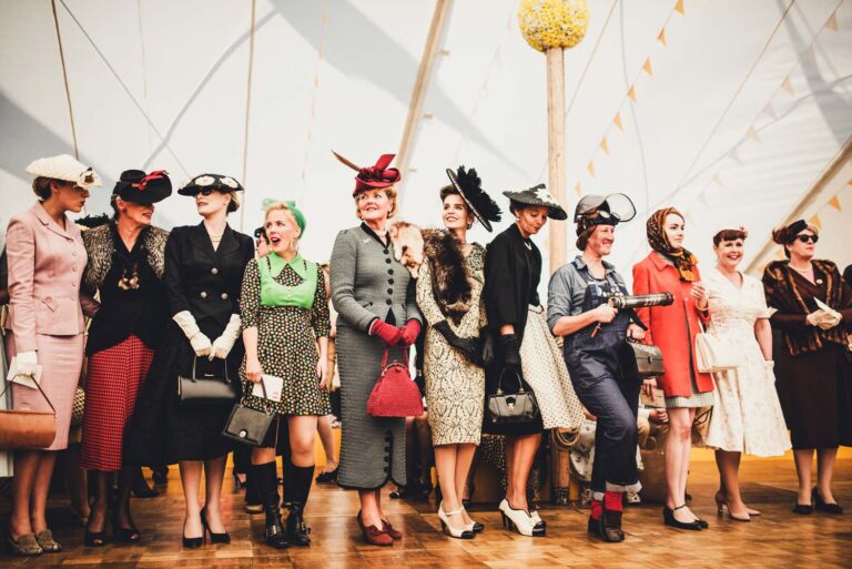 Visitors wearing authentic vintage fashion at the Goodwood Revival.