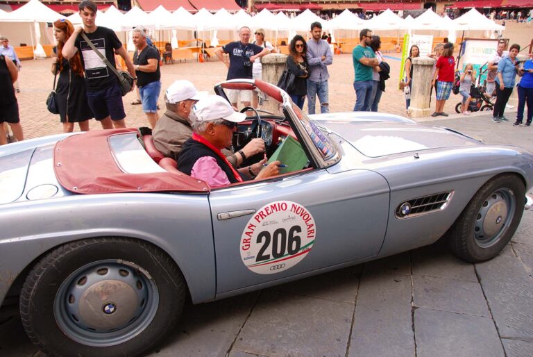 Historic BMW 507 at the Gran Premio Nuvolari in a historic Italian piazza.