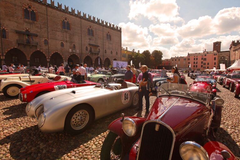 Historic sports cars gathered in Piazza Sordello, Mantua, during the Gran Premio Nuvolari.