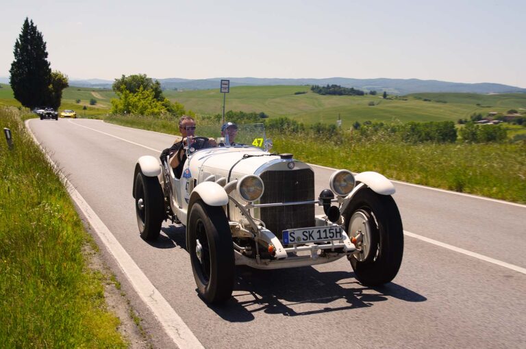 Historic Mercedes-Benz SSK driving through the Tuscan countryside during the Mille Miglia.