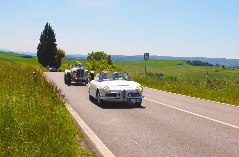 Alfa Romeo Giulietta Spider driving through Tuscany during the Mille Miglia.