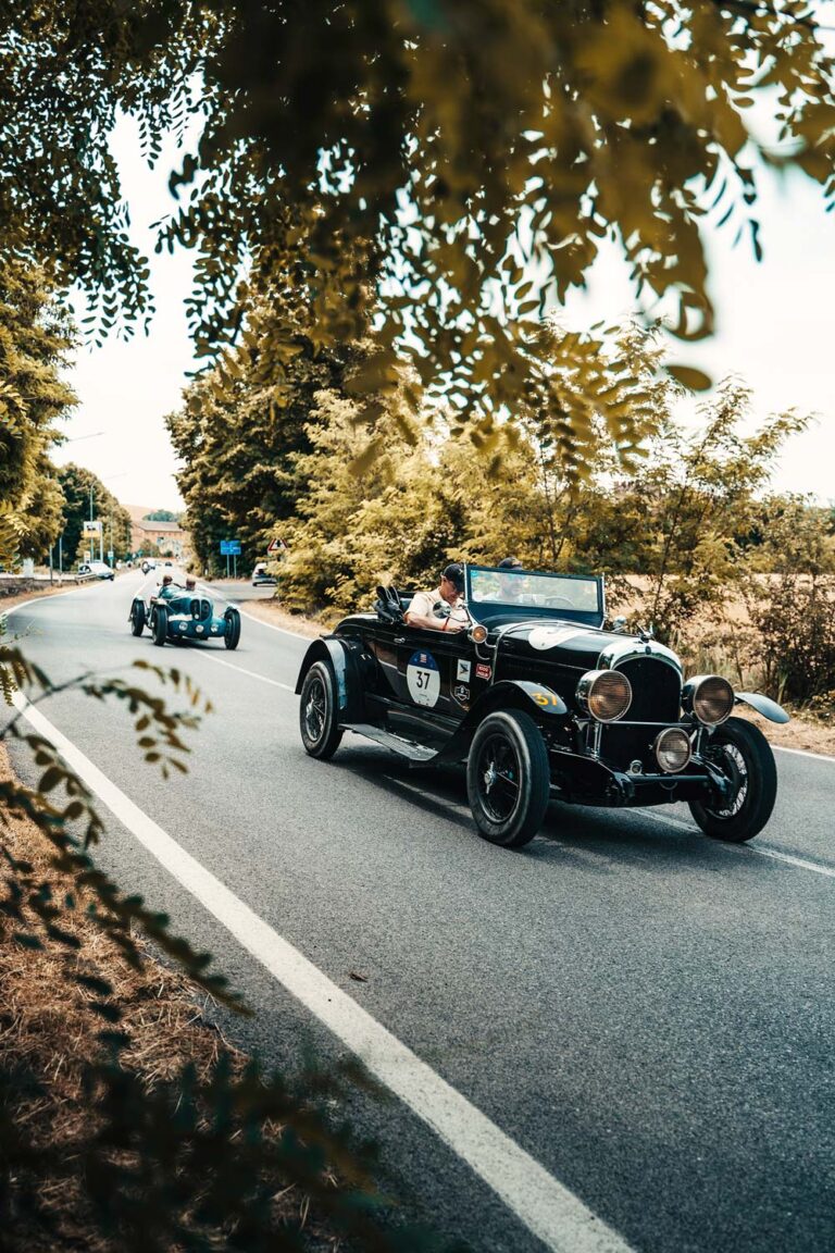 Pre-war classic cars driving during the Mille Miglia.