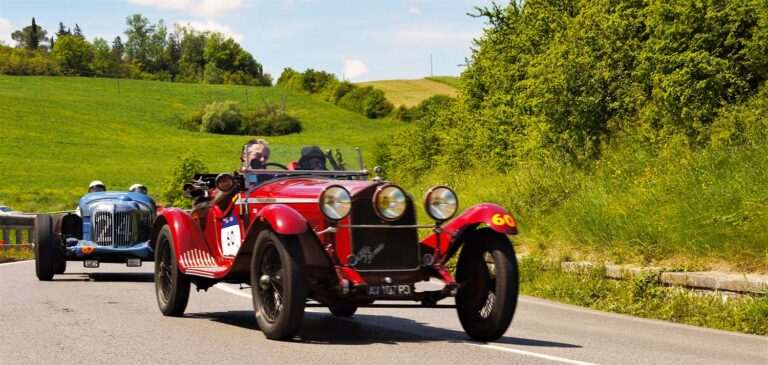 Historic Alfa Romeo and Bugatti driving during the Mille Miglia.