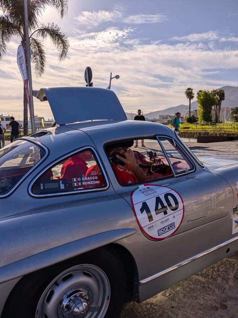 Mercedes-Benz 300 SL Coupé with rally participants at Palermo harbour before the Targa Florio.