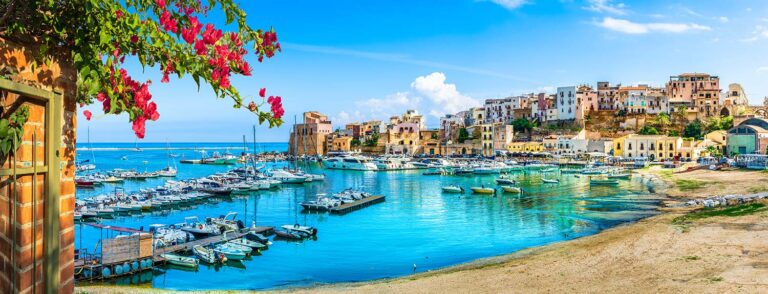 Historic harbour of Cefalù on Sicily's northern coast near the legendary Targa Florio route.